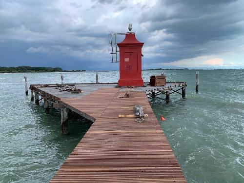 La conclusione dei lavori di ripristino del pontile del faro di Lignano