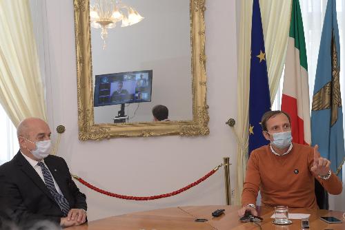Il governatore Massimiliano Fedriga e il sindaco di Trieste Roberto Dipiazza nel corso della videoconferenza